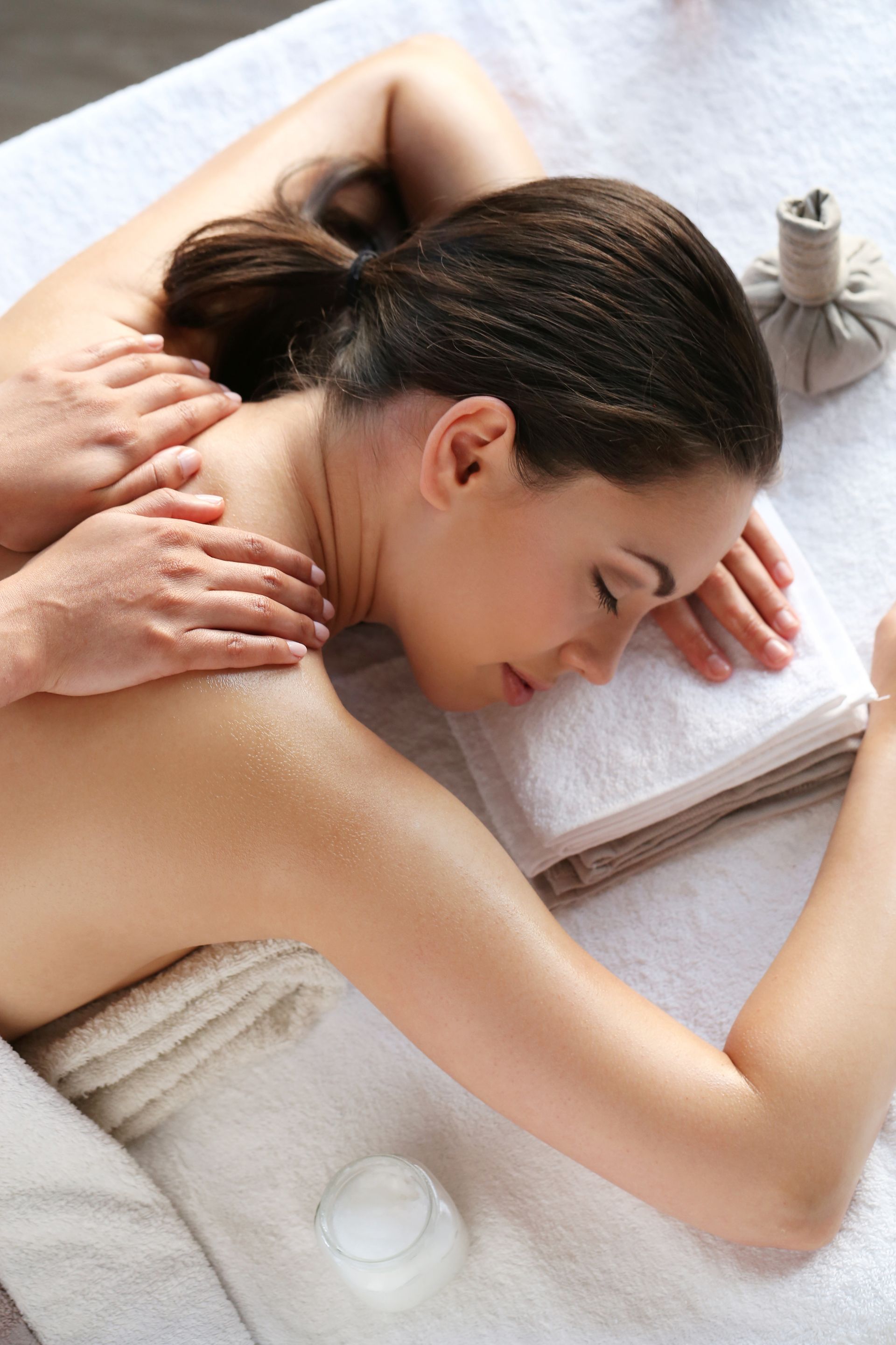 A woman is getting a massage at a spa.