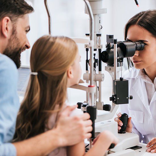 Dad With Daughter In Ophthalmology — Defiance, OH — Professional Vision Services, LLC