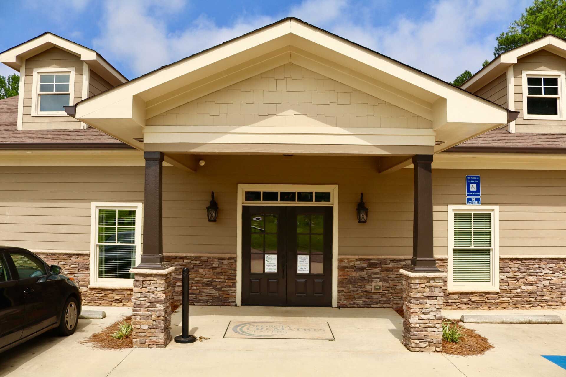 A house with a car parked in front of it