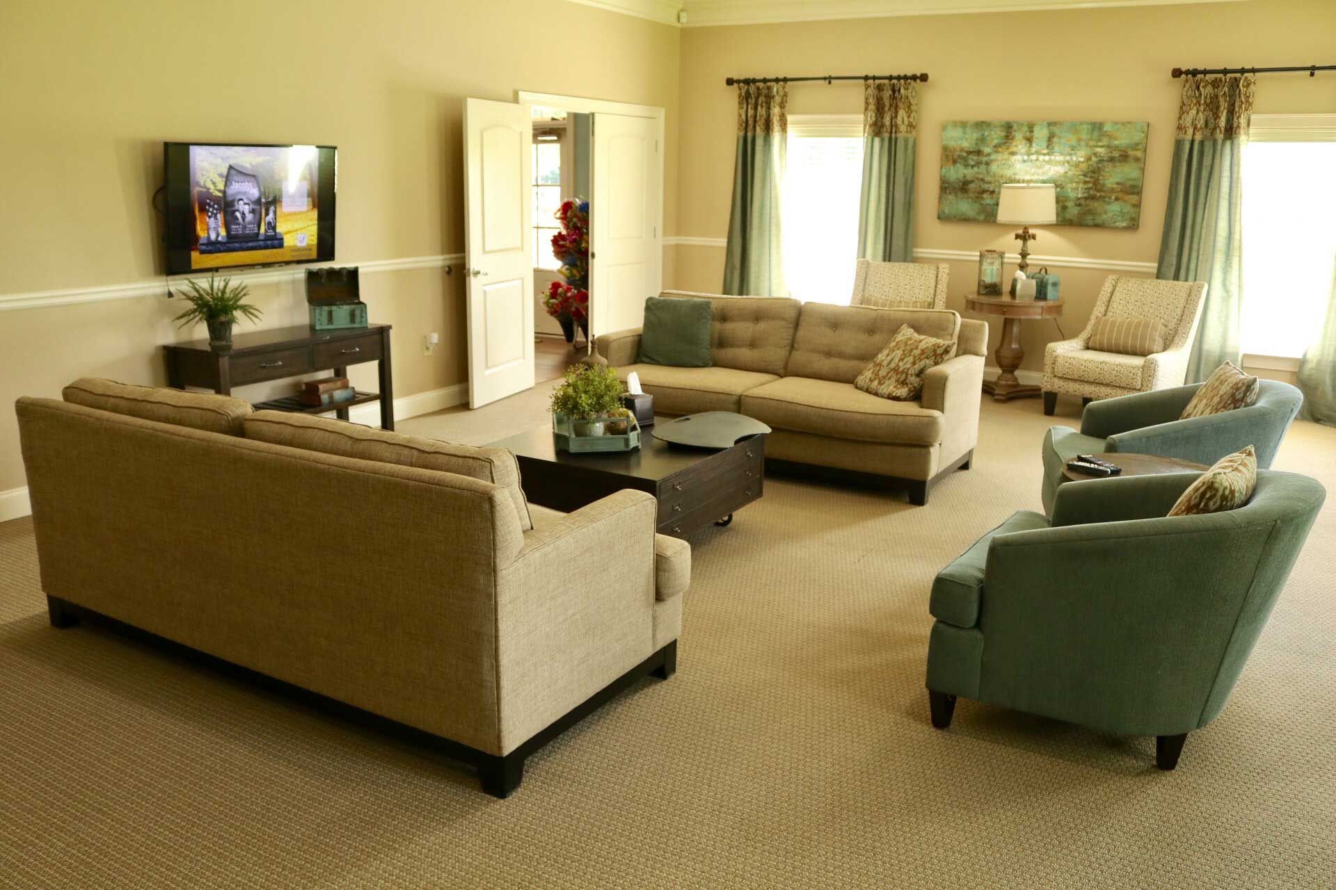 A living room filled with furniture and a flat screen tv
