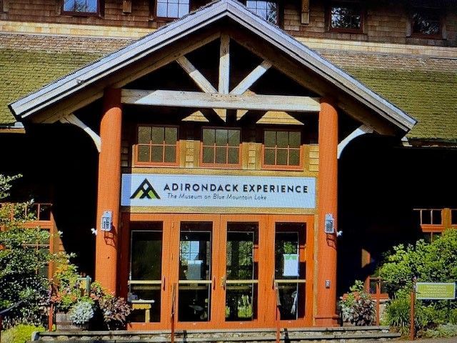 Adirondack experience is advertised on the front of this building