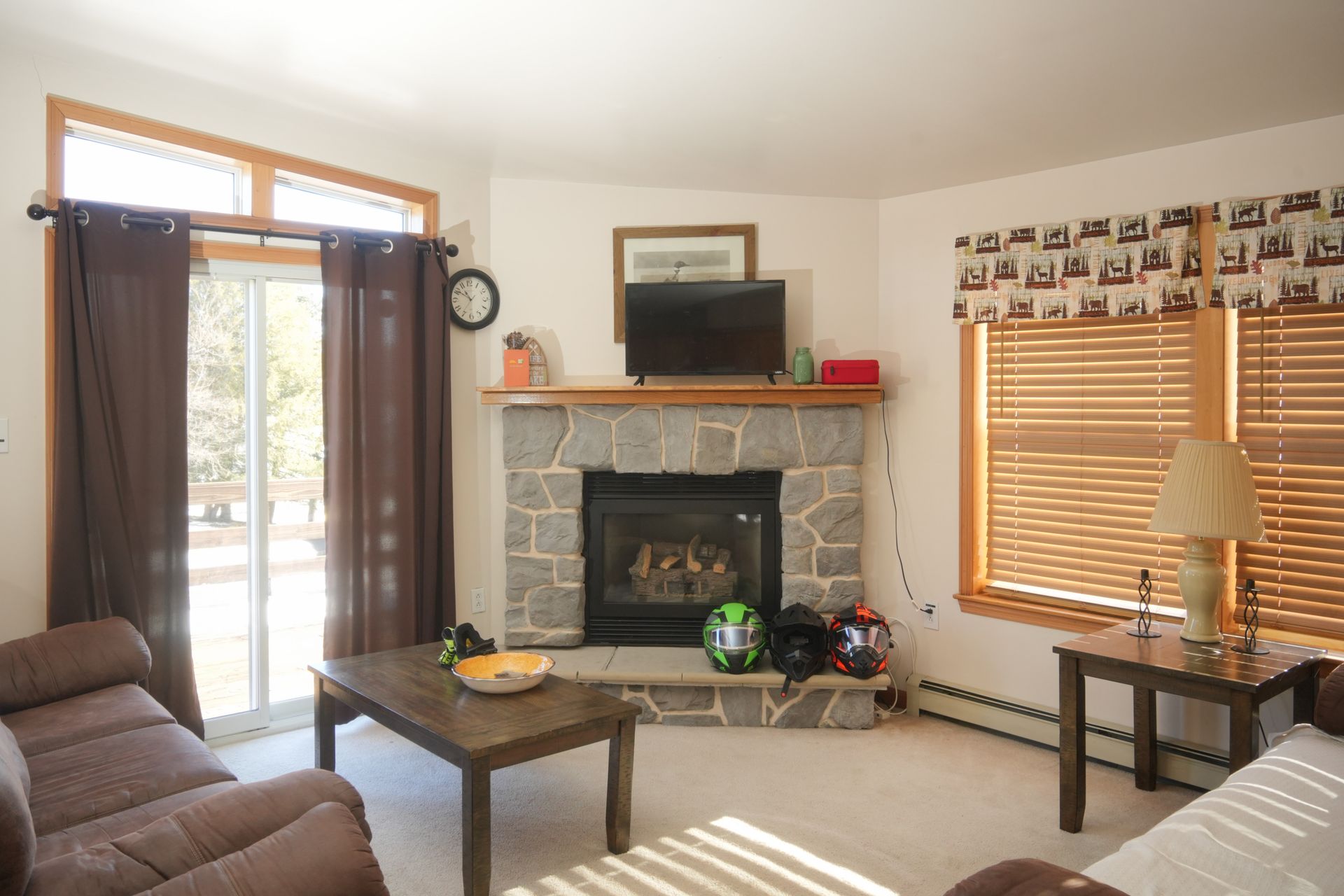 A living room with a fireplace and a couch