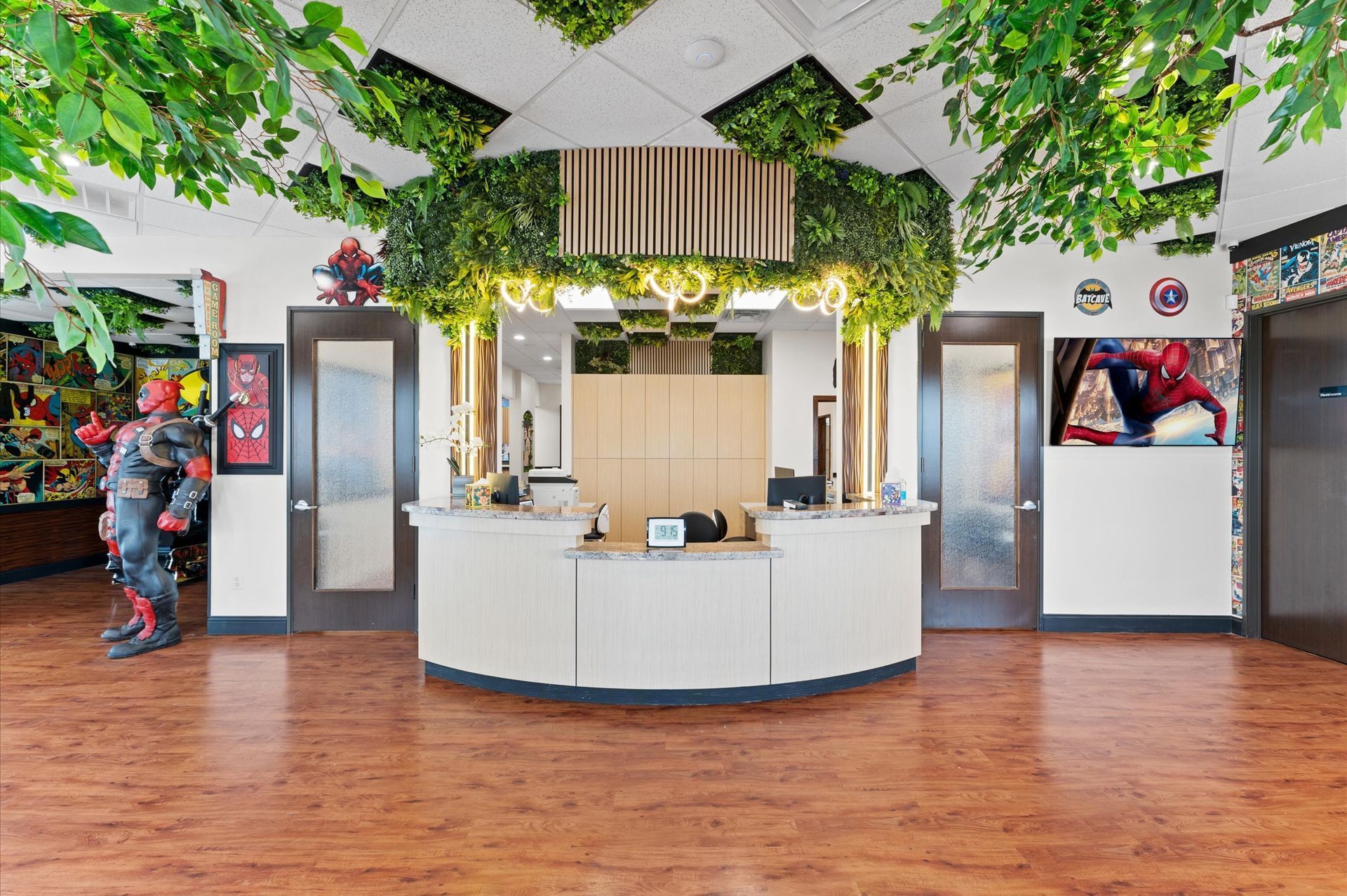 Adventure Smiles Dental & Orthodontics in Houston - There is a statue of a superhero in the middle of the room.