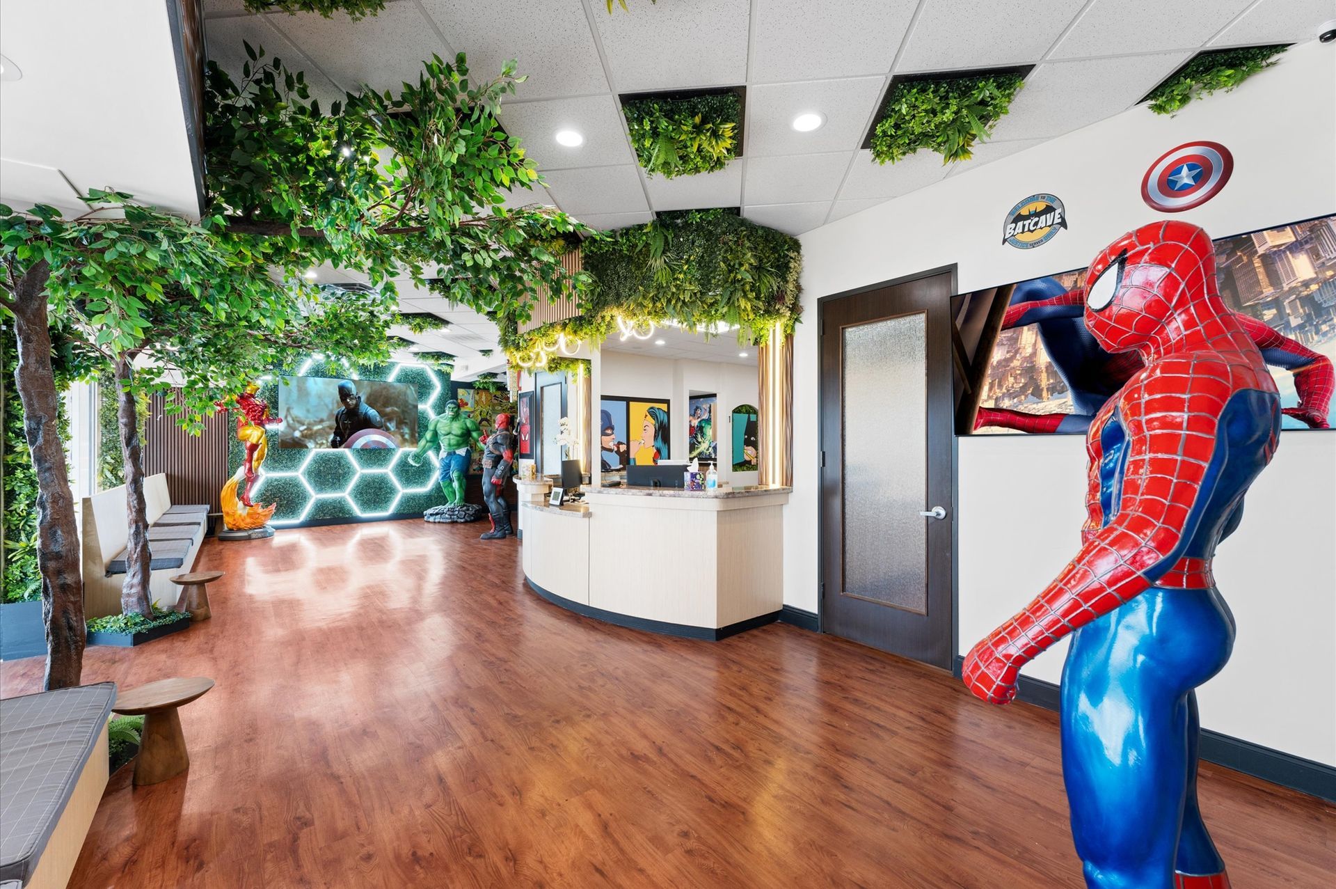Adventure Smiles Dental & Orthodontics in Houston - There is a statue of spider-man in the middle of the room.
