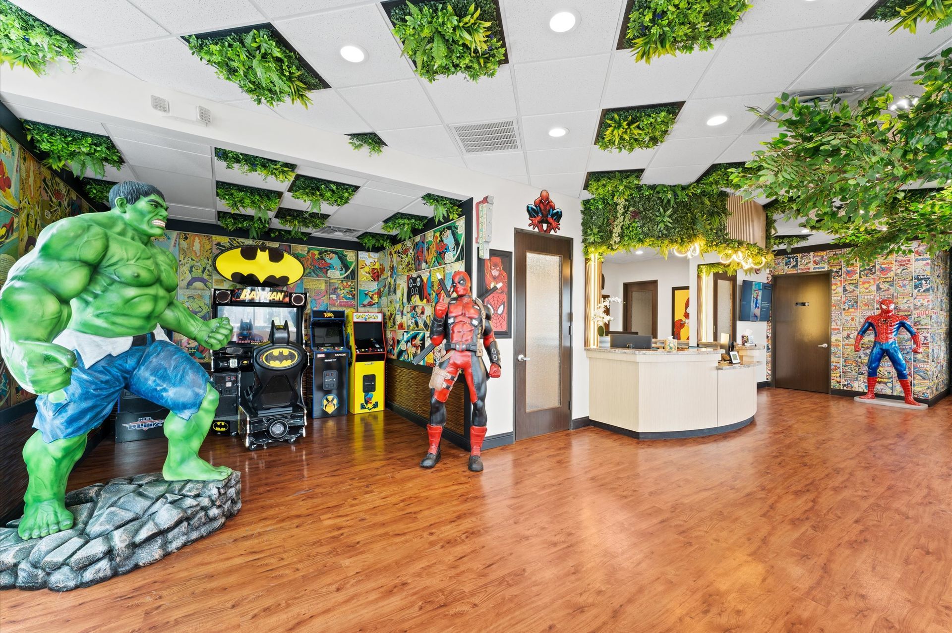 Adventure Smiles Dental & Orthodontics in Houston - A room with a statue of the hulk , batman , and deadpool.
