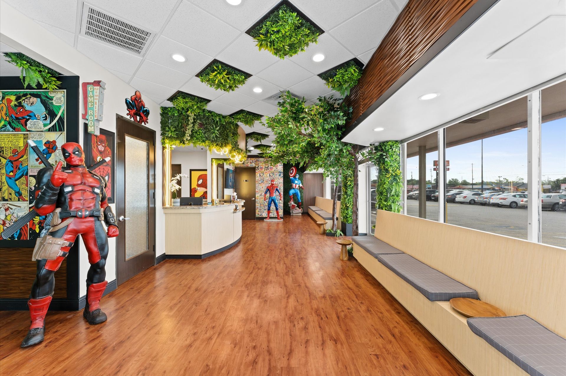 Adventure Smiles Dental & Orthodontics in Houston - A waiting room with a deadpool statue on the floor.