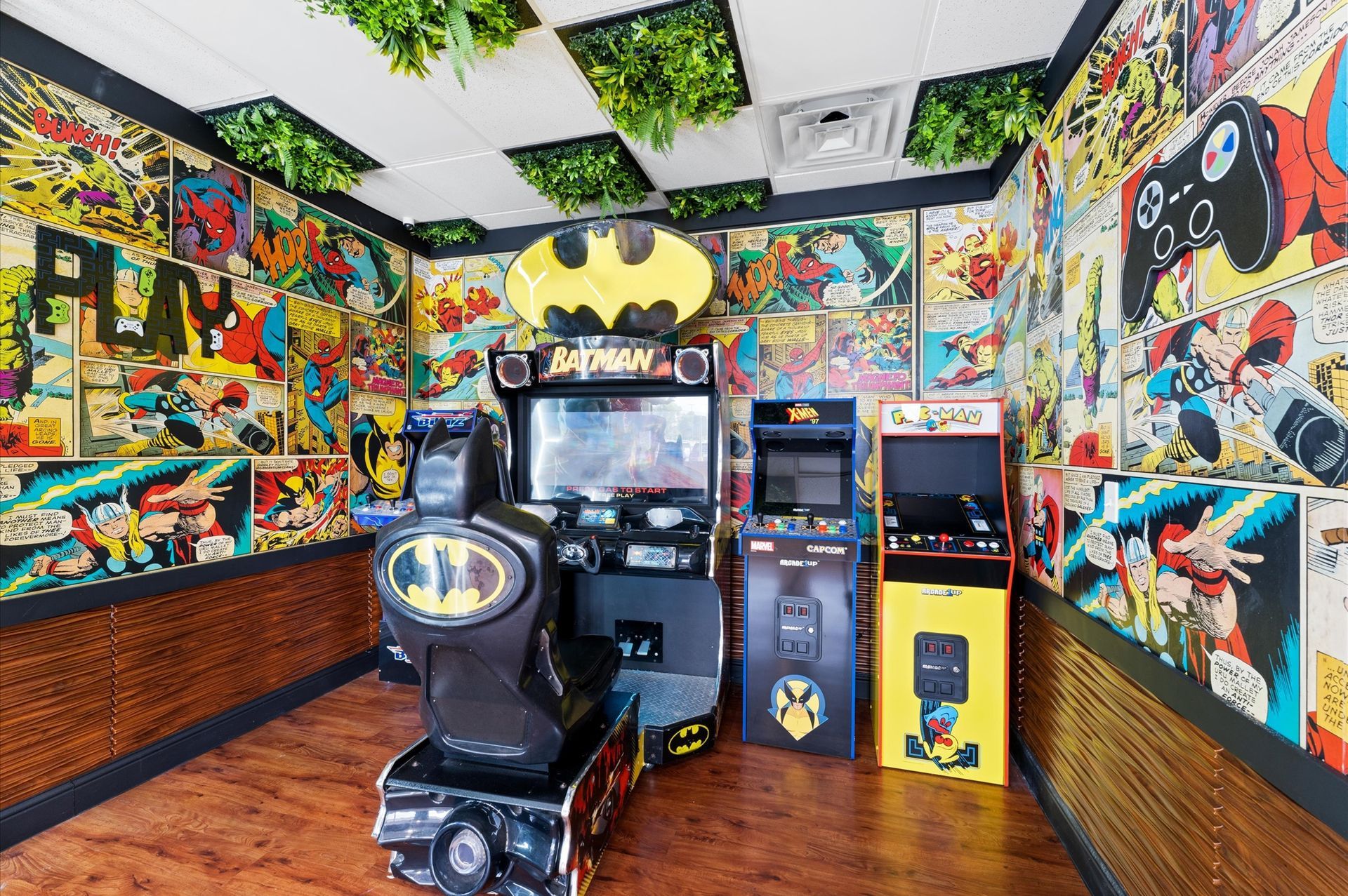 Adventure Smiles Dental & Orthodontics in Houston - A room with a batman arcade machine and two other arcade games.