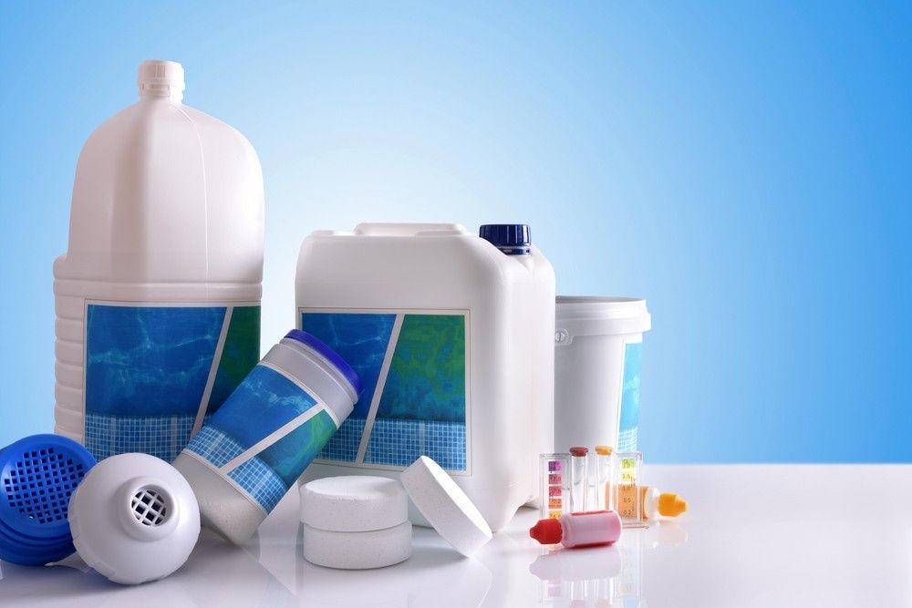 White Plastic Containers of Pool Chemicals and Accessories — Ultra Clear Pool Care in Cranbrook, QLD
