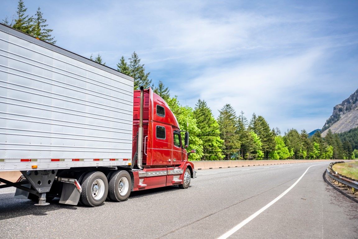 Enclosed semi truck transporting premium vehicles.