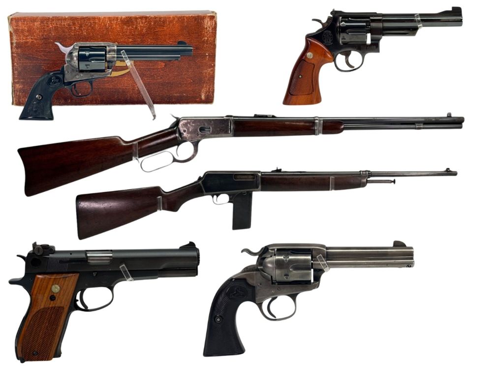 Various firearms displayed on a white background, including revolvers and rifles, plus a handgun in a wooden case