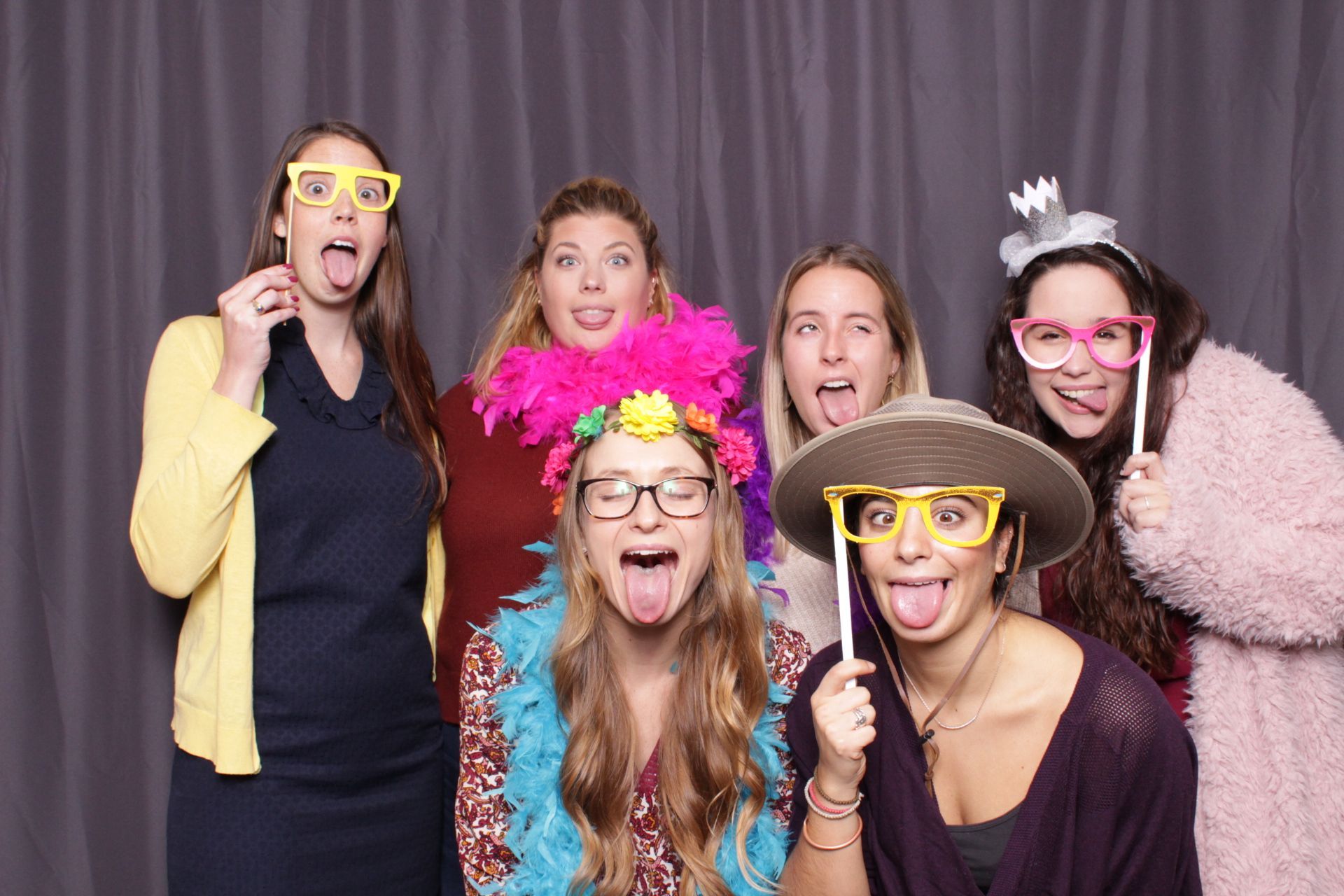 a group of women are posing for a picture in a Ever After photo booth at a bachelorette party