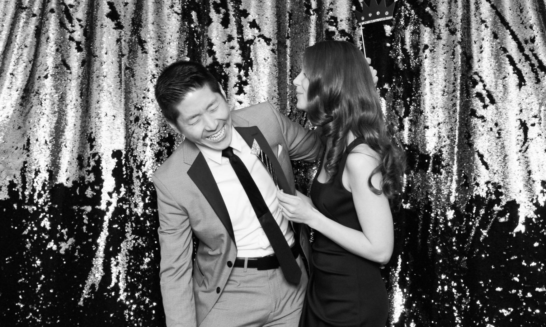 Laughter and emotion in this photo of a couple at an event, captured in black and white by Ever After