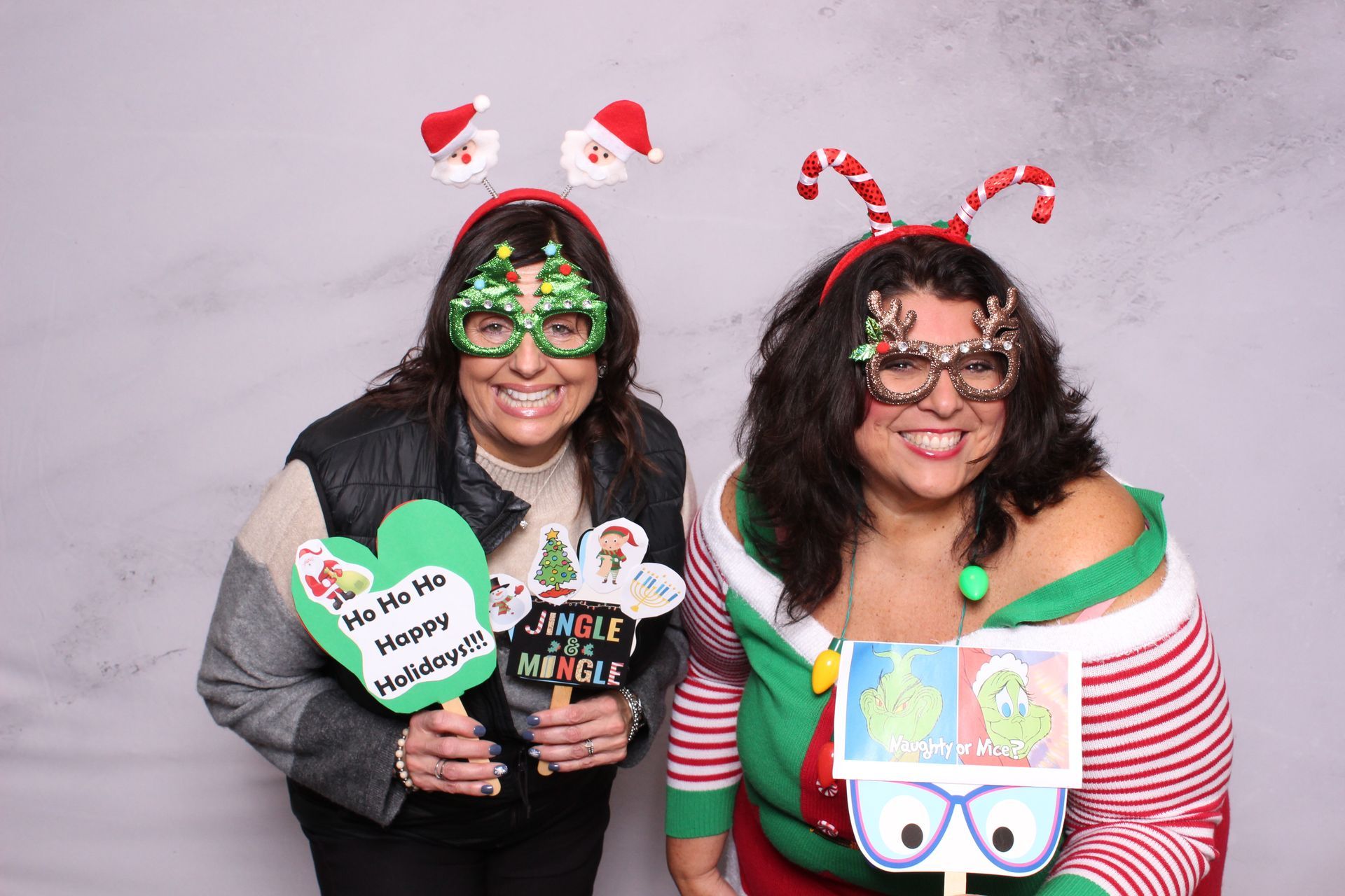 Close up of two Glam Photo Booth photo takers