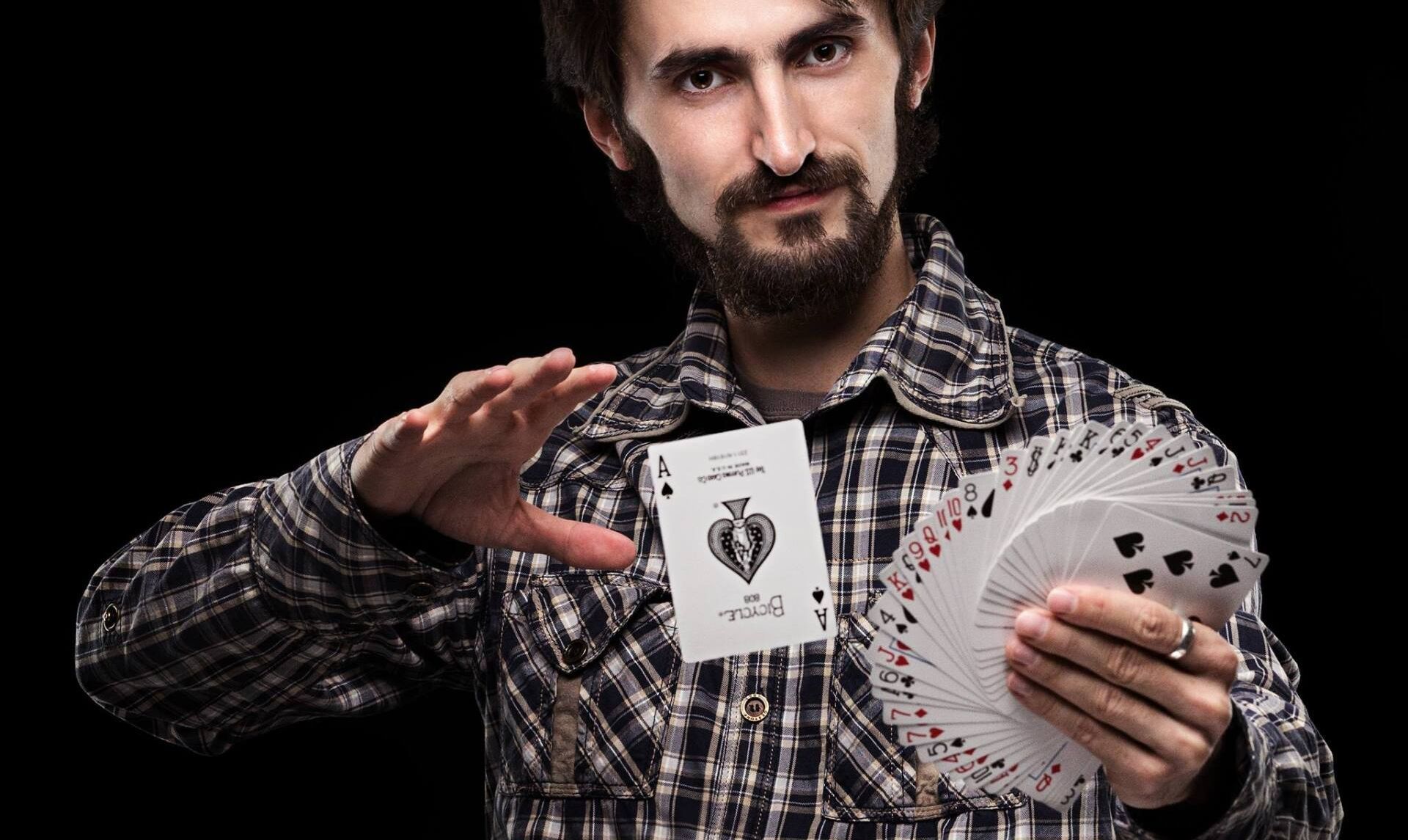 Magician with a floating Ace of Spades as an alternative to a photo booth
