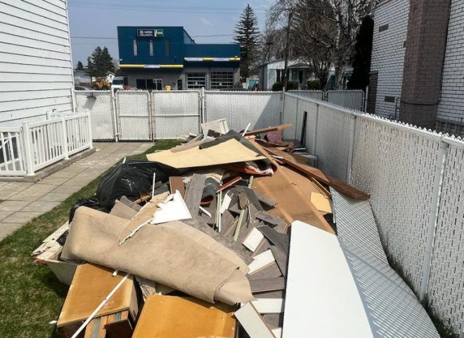 A pile of junk is sitting in front of a building that says kmart