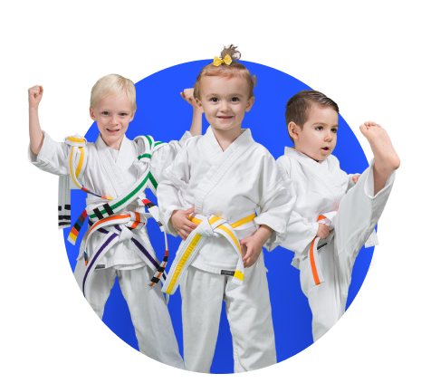 Three children in karate uniforms are standing next to each other in a blue circle.