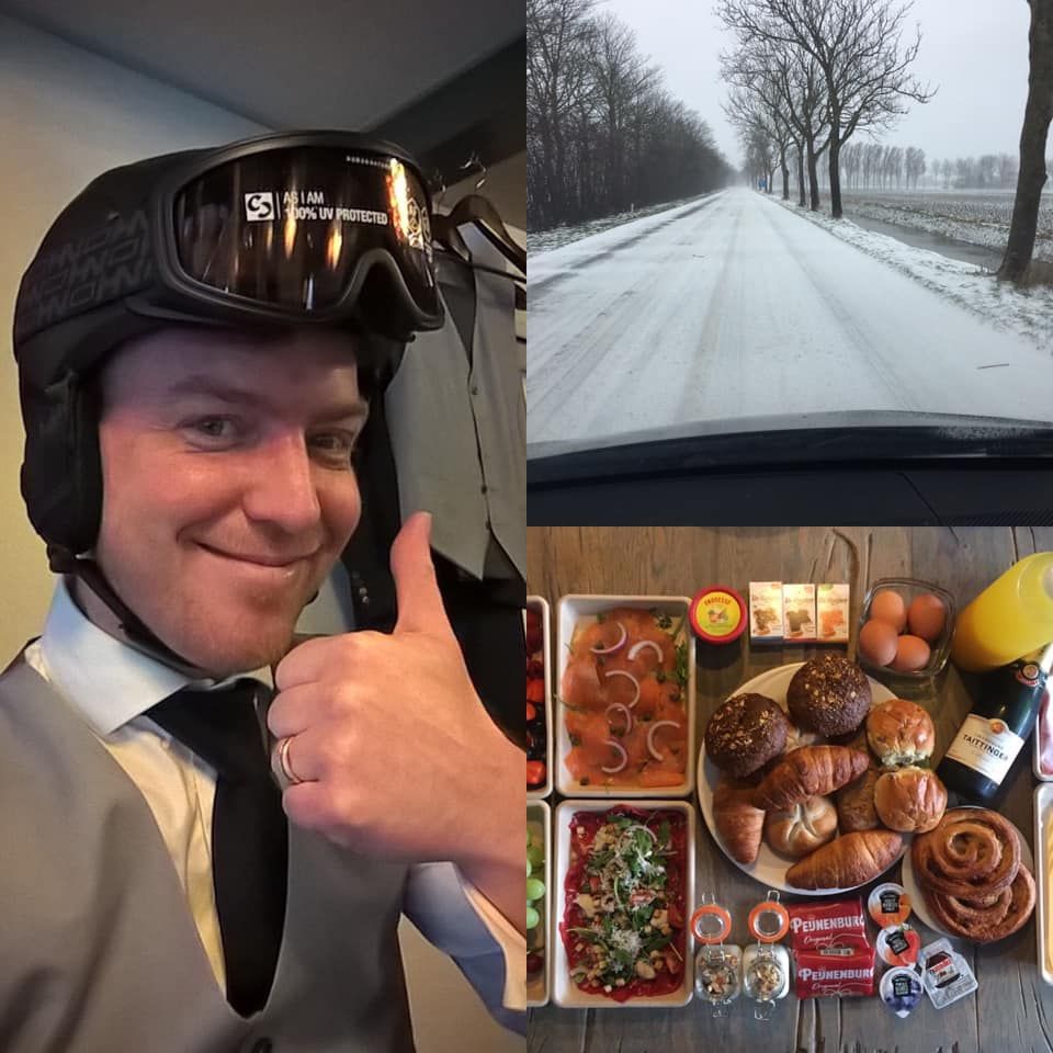 Een man met een helm en een bril steekt zijn duim omhoog
