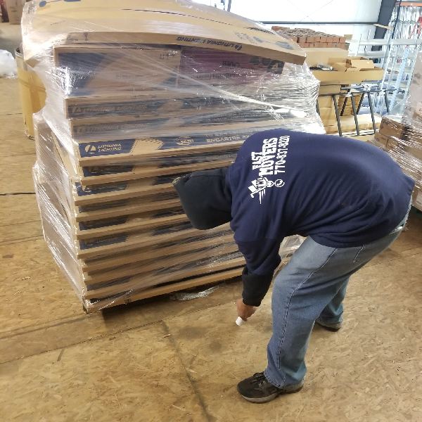 A man wearing a shirt that says ' best buy ' on it