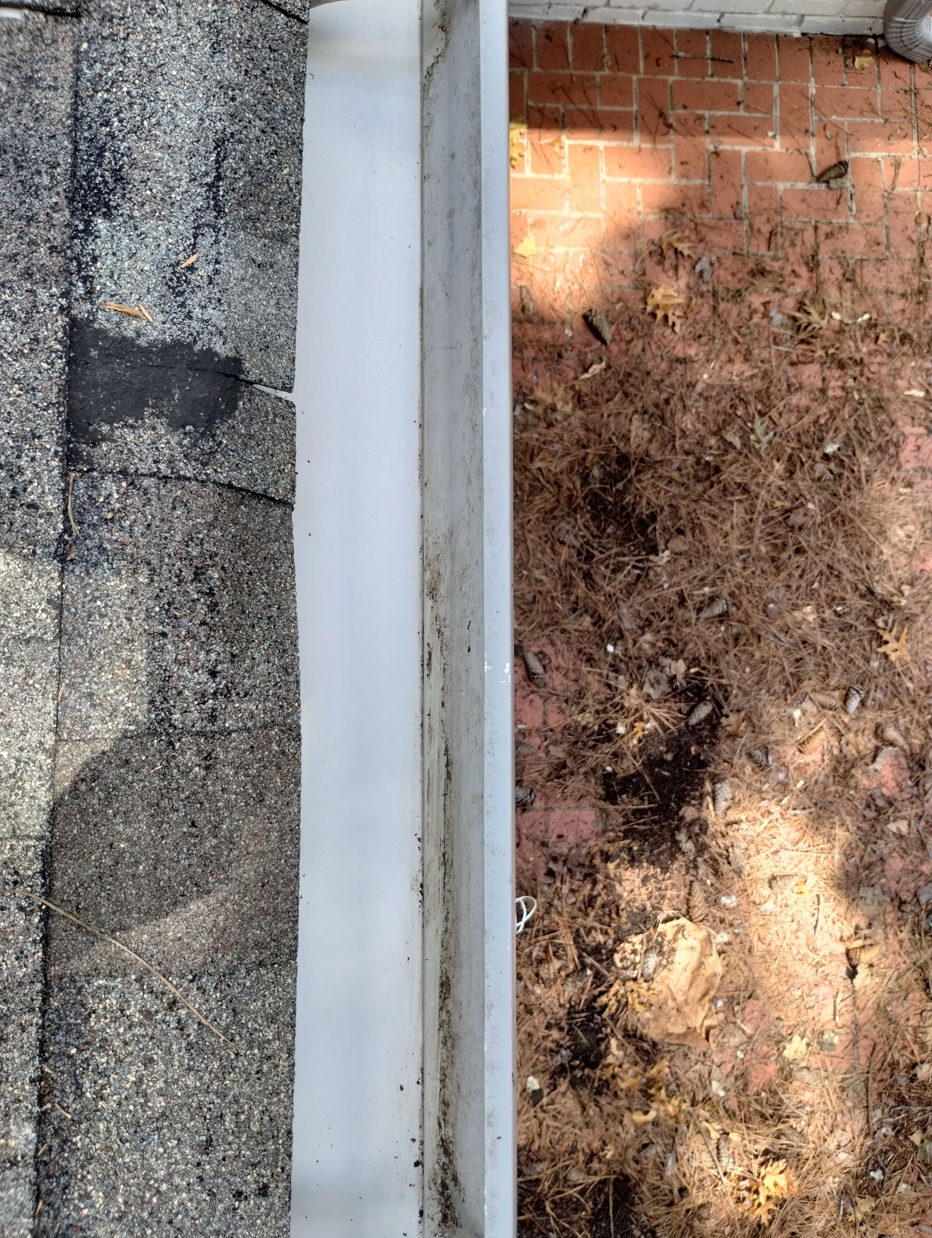 A picture of a roof before and after being cleaned