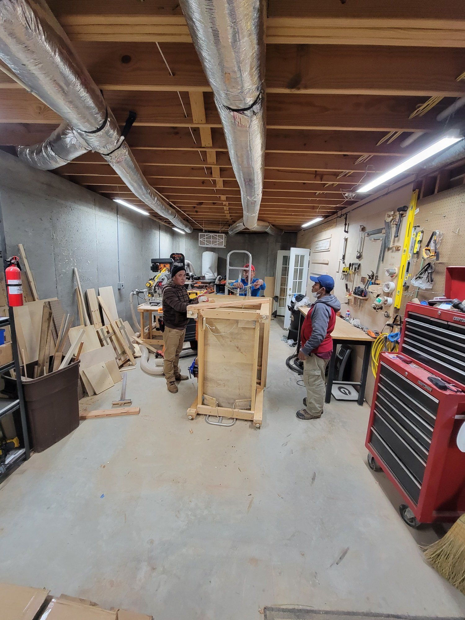 A group of people are working in a workshop.