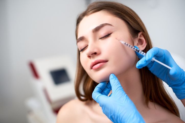 woman being injected with dermal filler