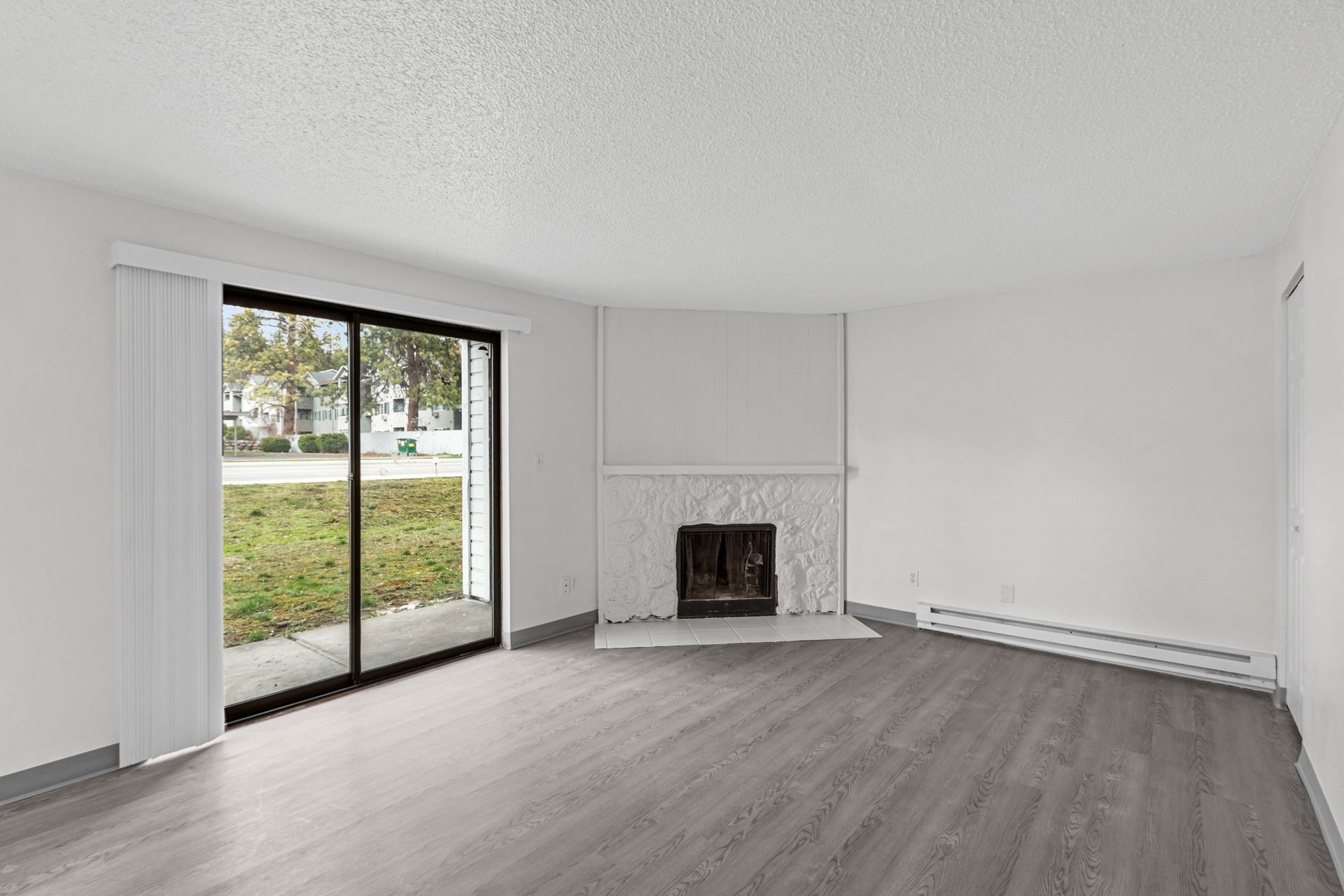 Houk 33 living room with fireplace and sliding glass door
