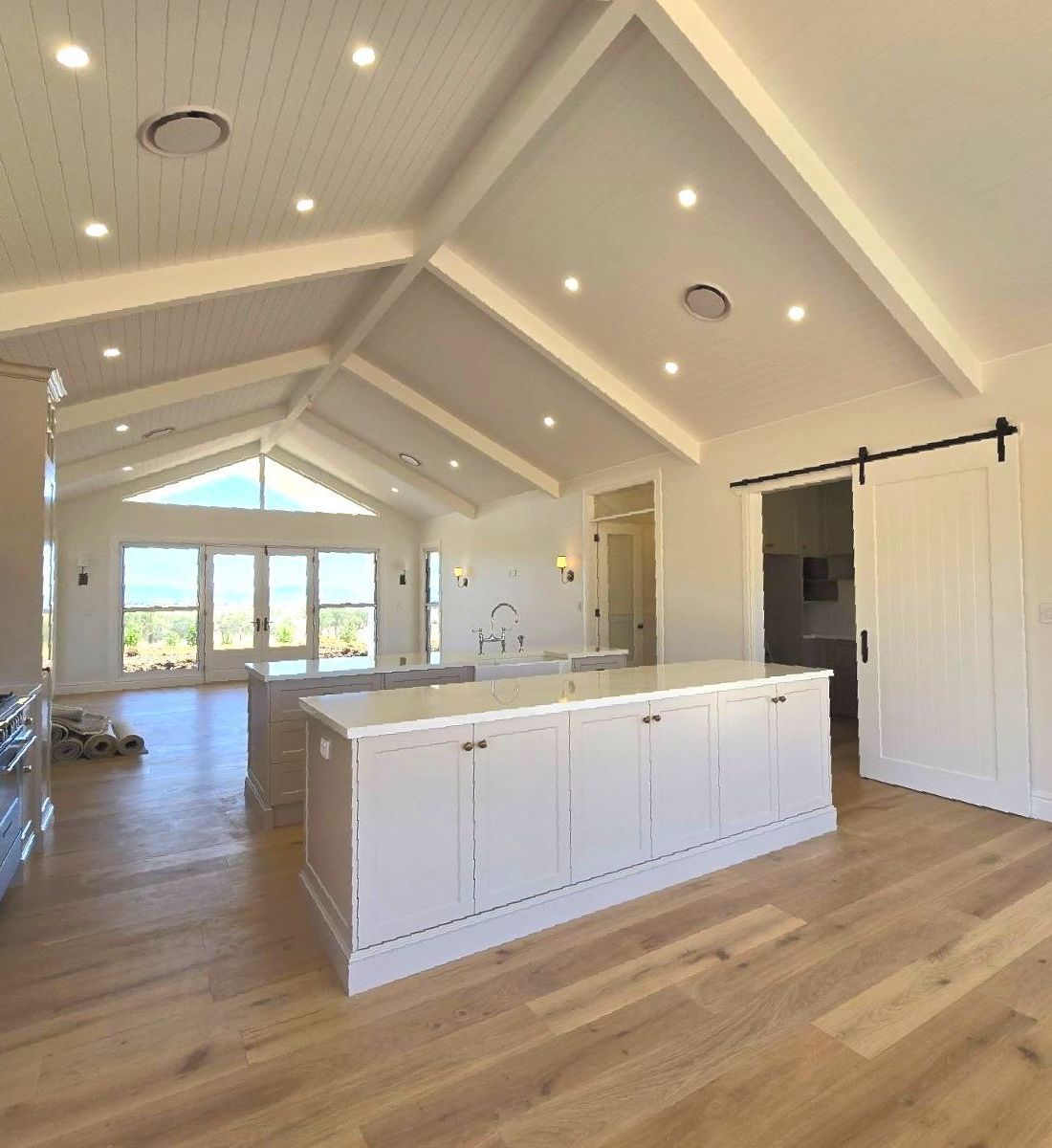 Exposed Wooden Truss Painted White in a White Kitchen — Trussframe in Armidale, NSW
