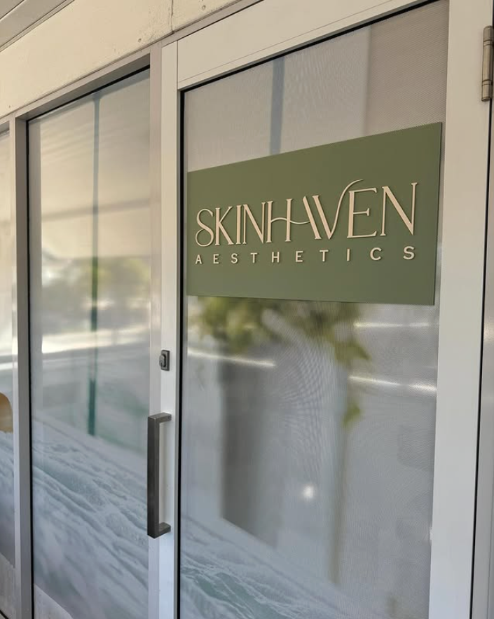Exterior view of Skin Haven Aesthetics business entrance. Green sign with white text.— Skin Haven Aesthetics Whitsundays in Airlie Beach, QLD