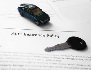 Car Insurance — A Miniature Car with a Key In Mcalester, OK