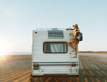 How Much For Car Insurance — Woman on a Travel Trailer  In Mcalester, OK