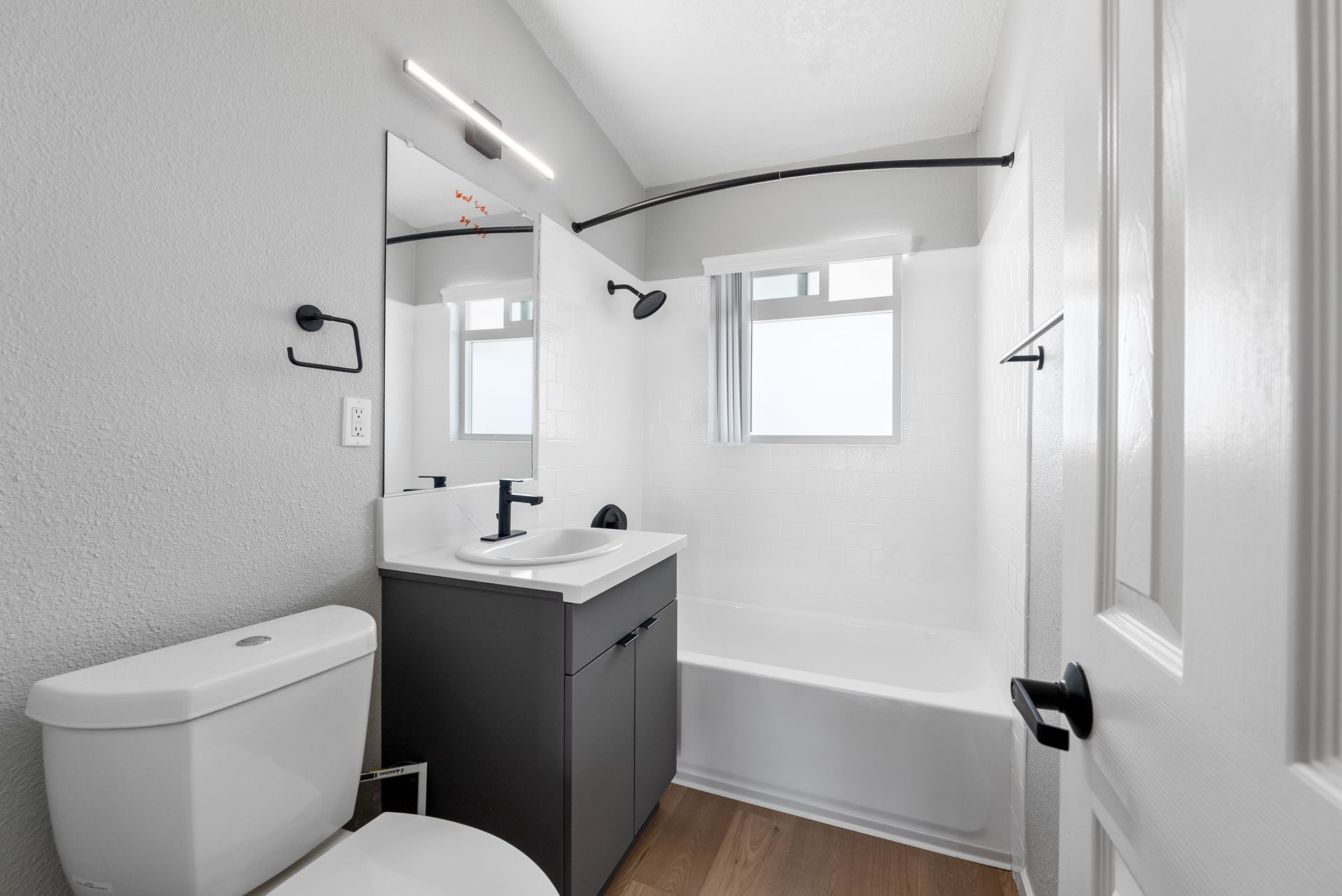 Bathroom with sink, shower, and toilet