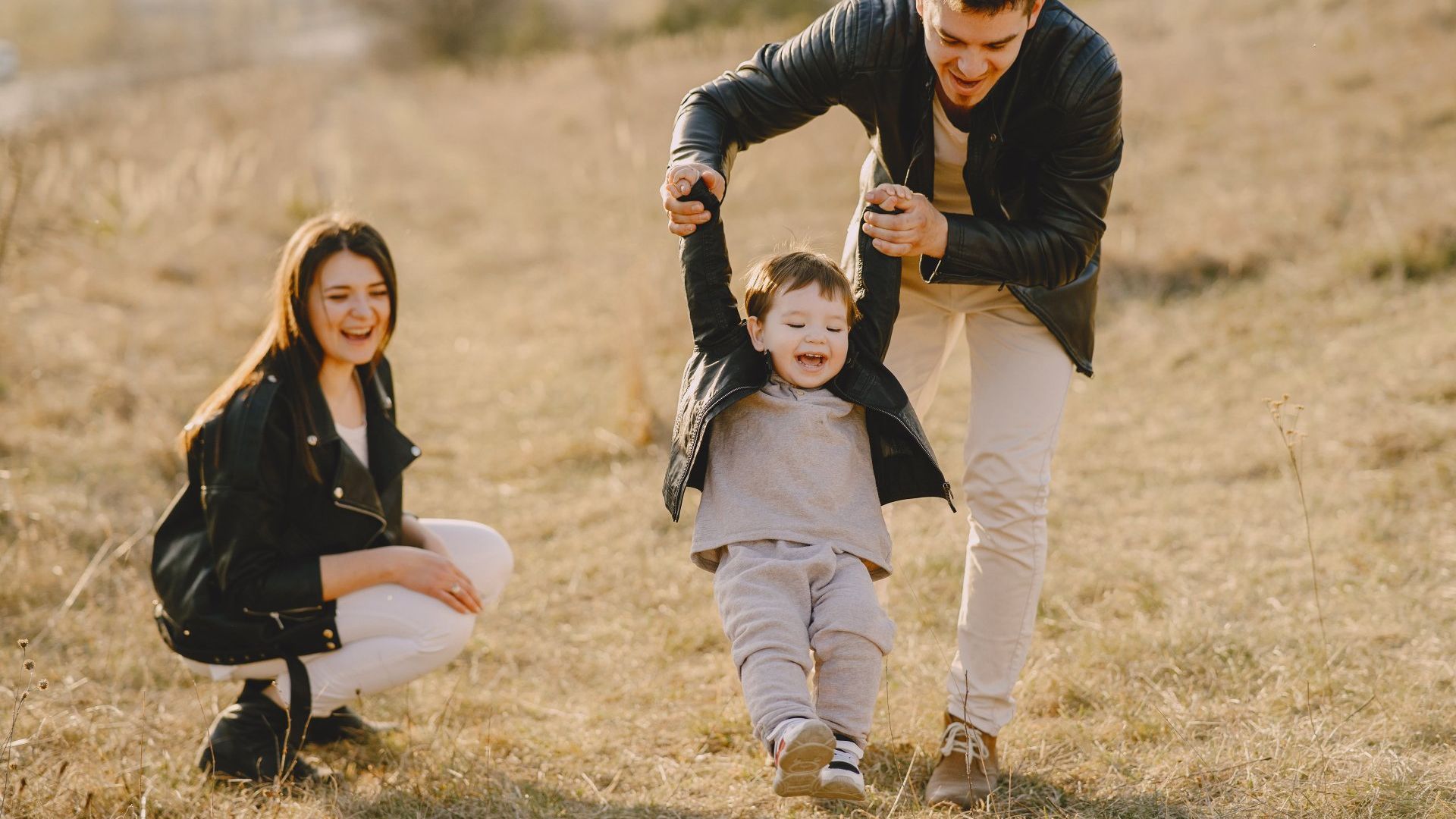 family playing in field