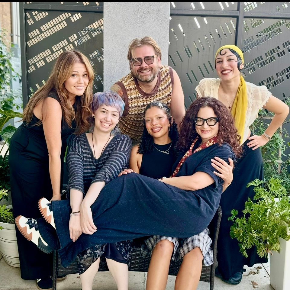 A group of people are posing for a picture together