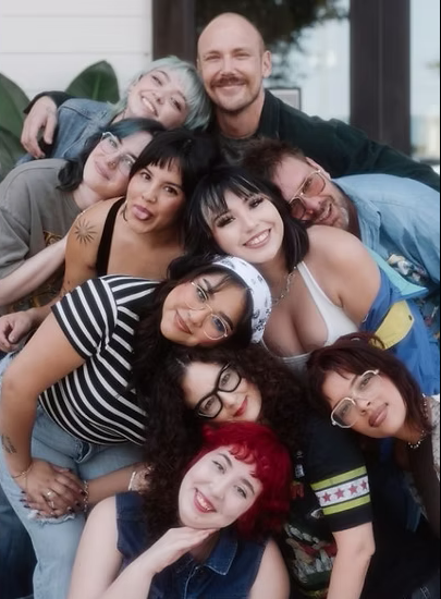 A group of people are posing for a picture together
