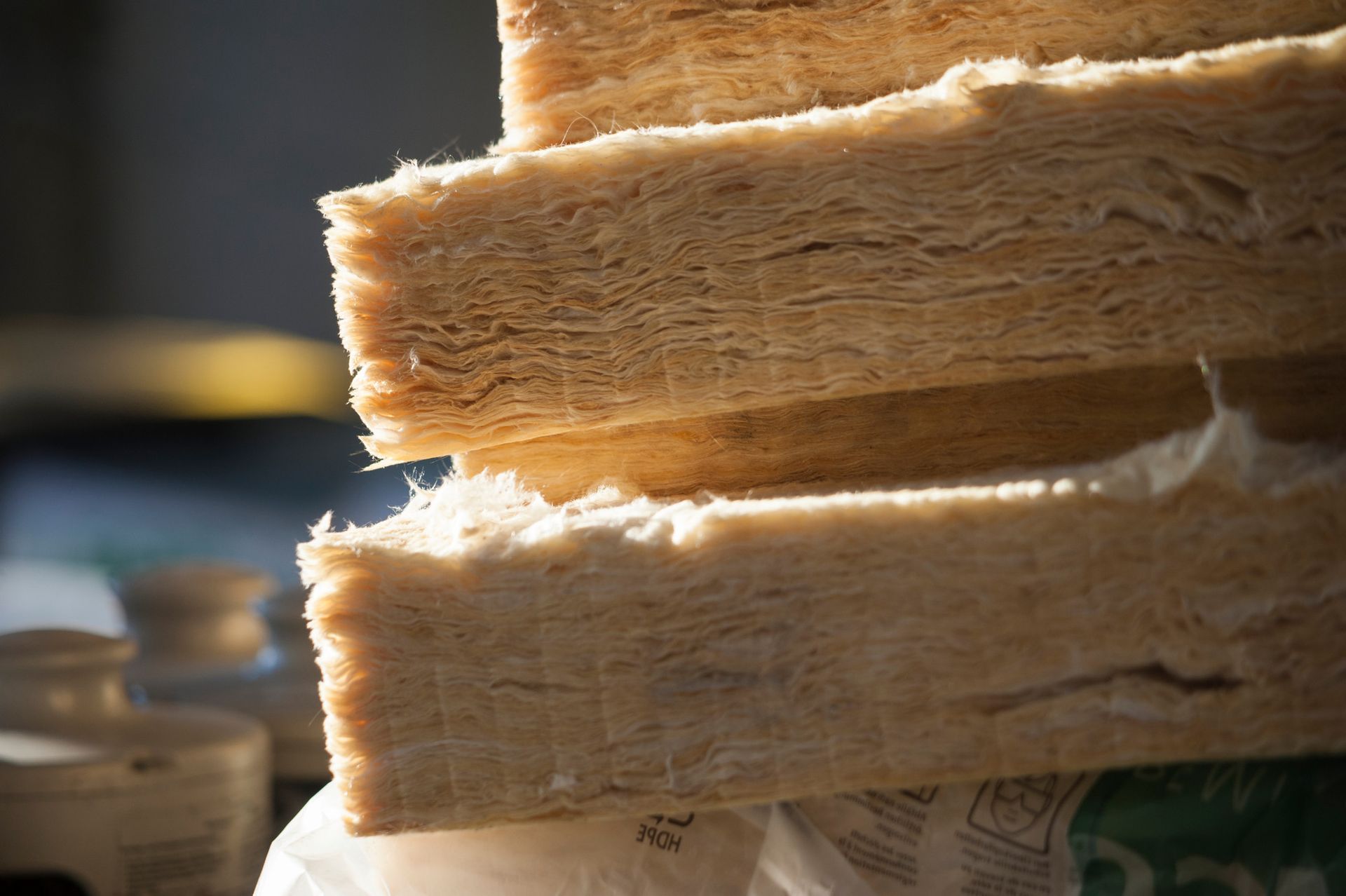 a close up of a stack of home insulation on top of each other .