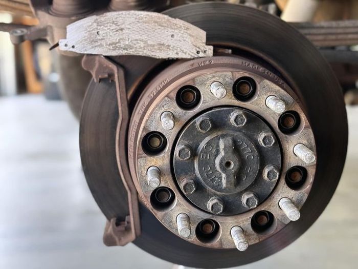 Worn brake rotors and pads needing repair at Quicker Sticker