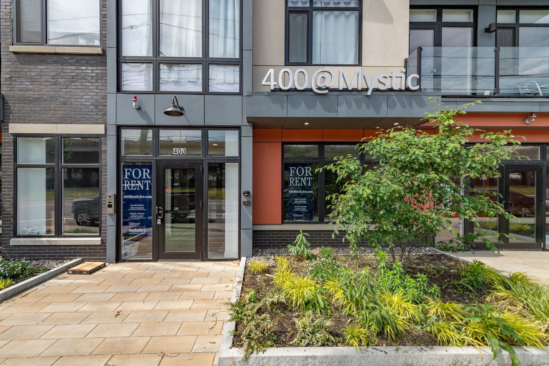 Exterior of 400 @ Mystic building with a storefront labeled 