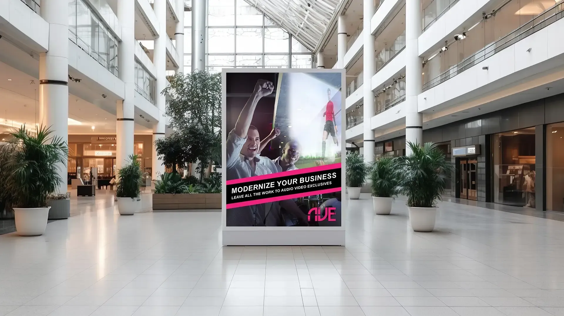 A large billboard is hanging in the middle of a mall.