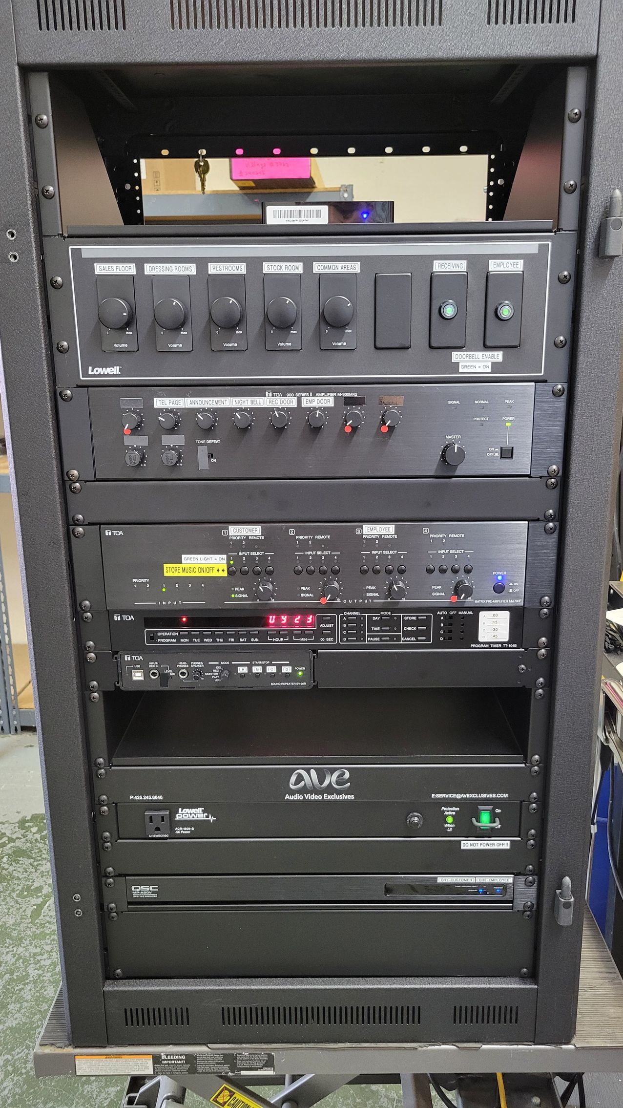 A rack with a bunch of electronic equipment on it