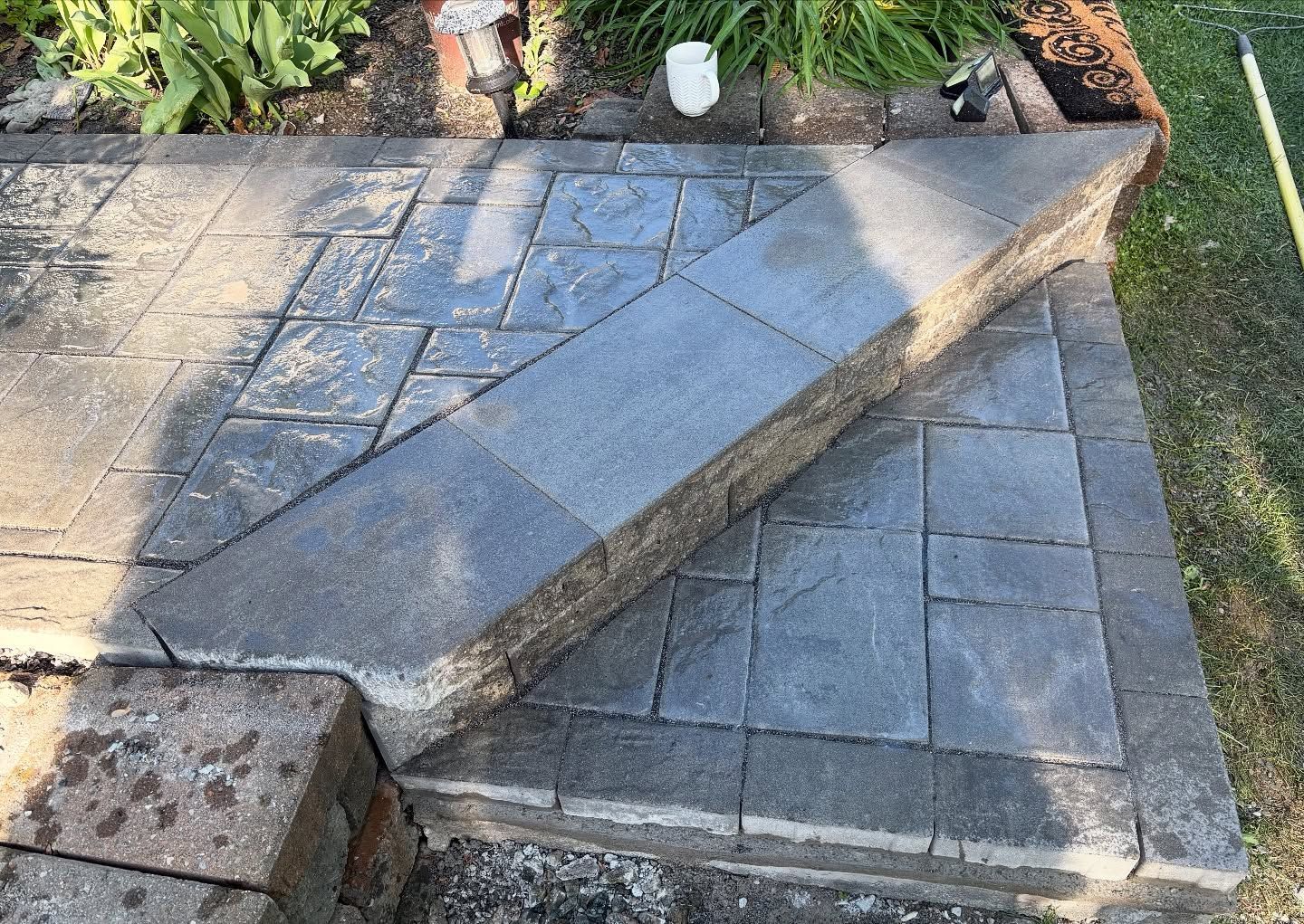 Stone steps and walkway construction in a garden setting.