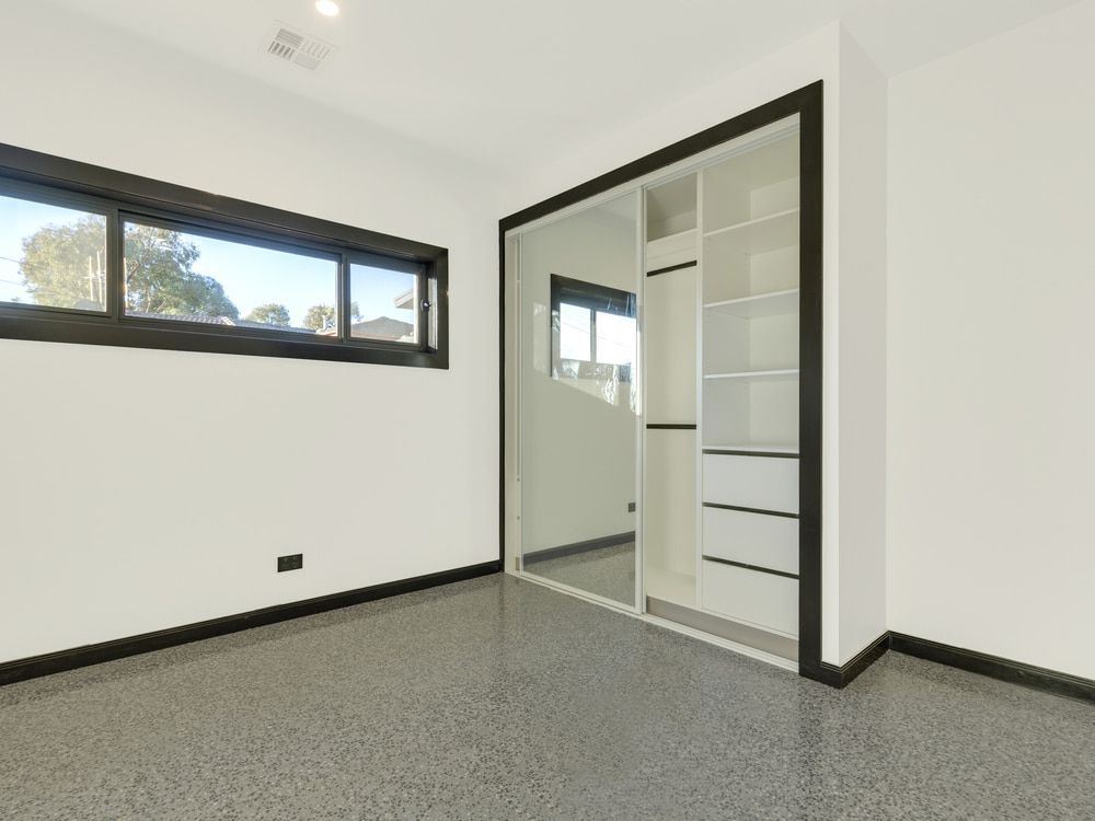 An empty room with a sliding glass door and a window. — Maryborough Bay Glass & Aluminium in Maryborough, QLD