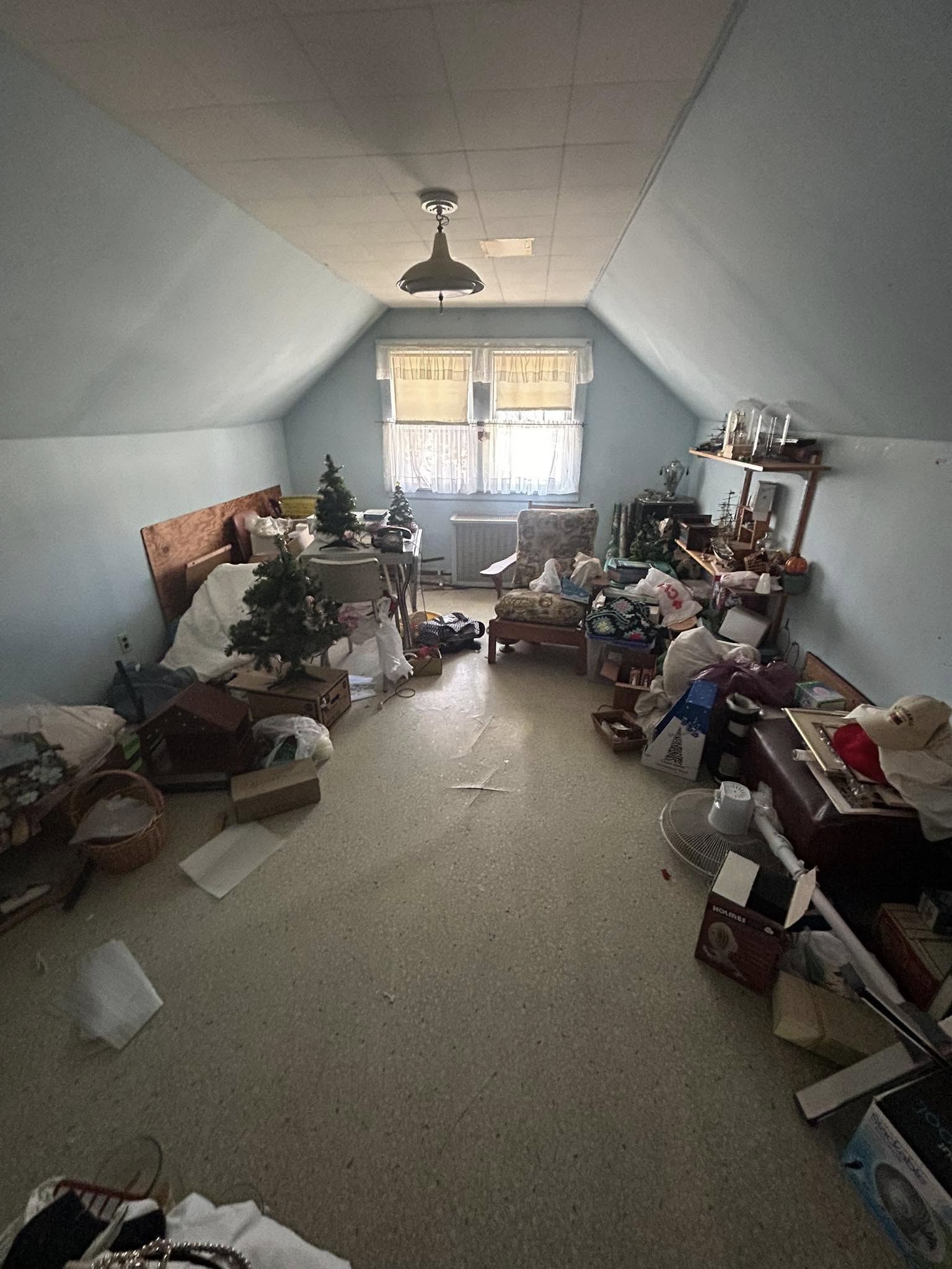 A living room filled with lots of furniture and a christmas tree.
