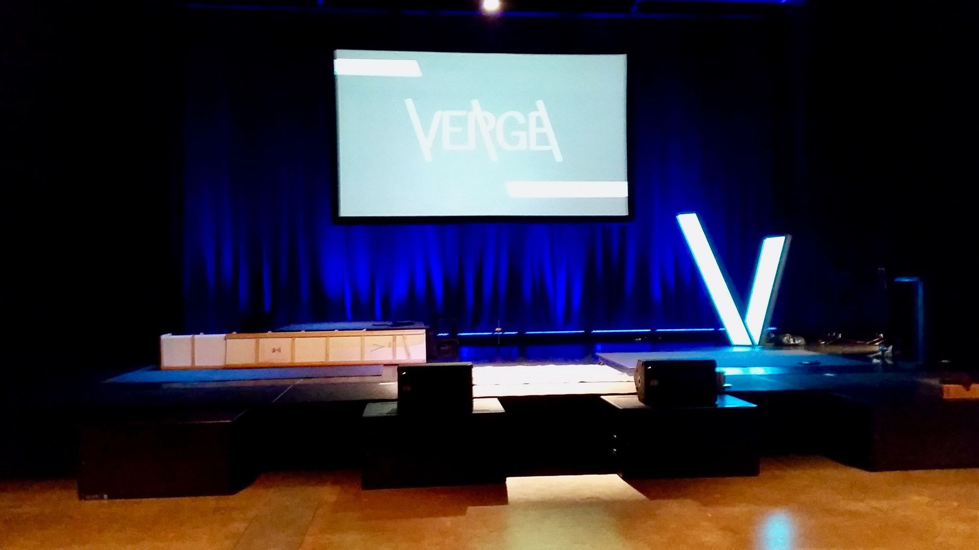 A stage with a large screen that says vetech on it