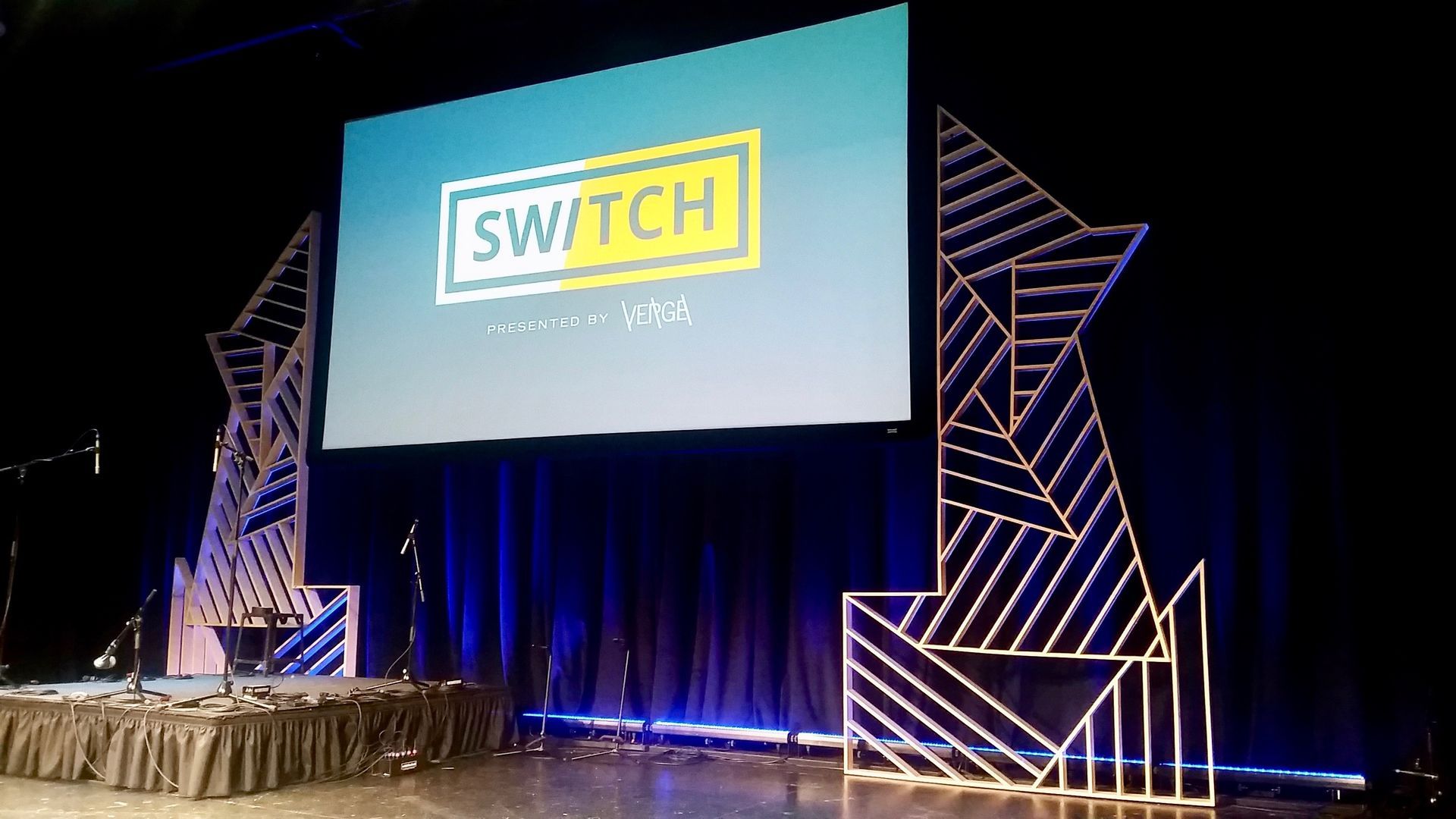 A large screen is sitting on top of a stage.