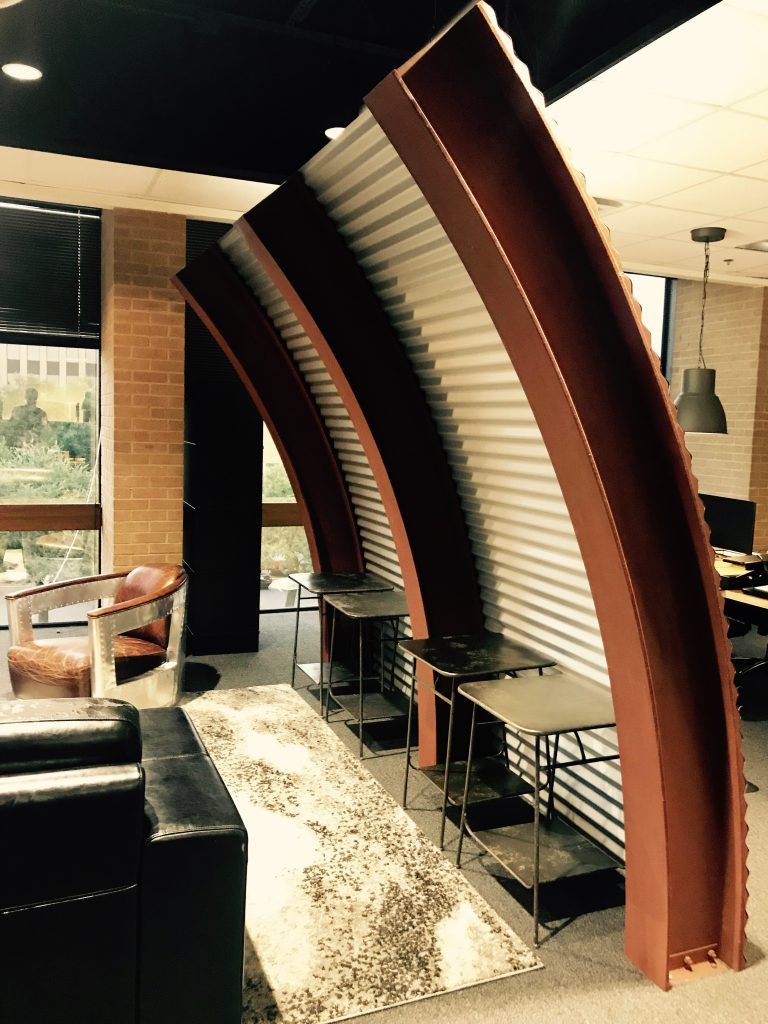 A living room with a couch and chairs in it