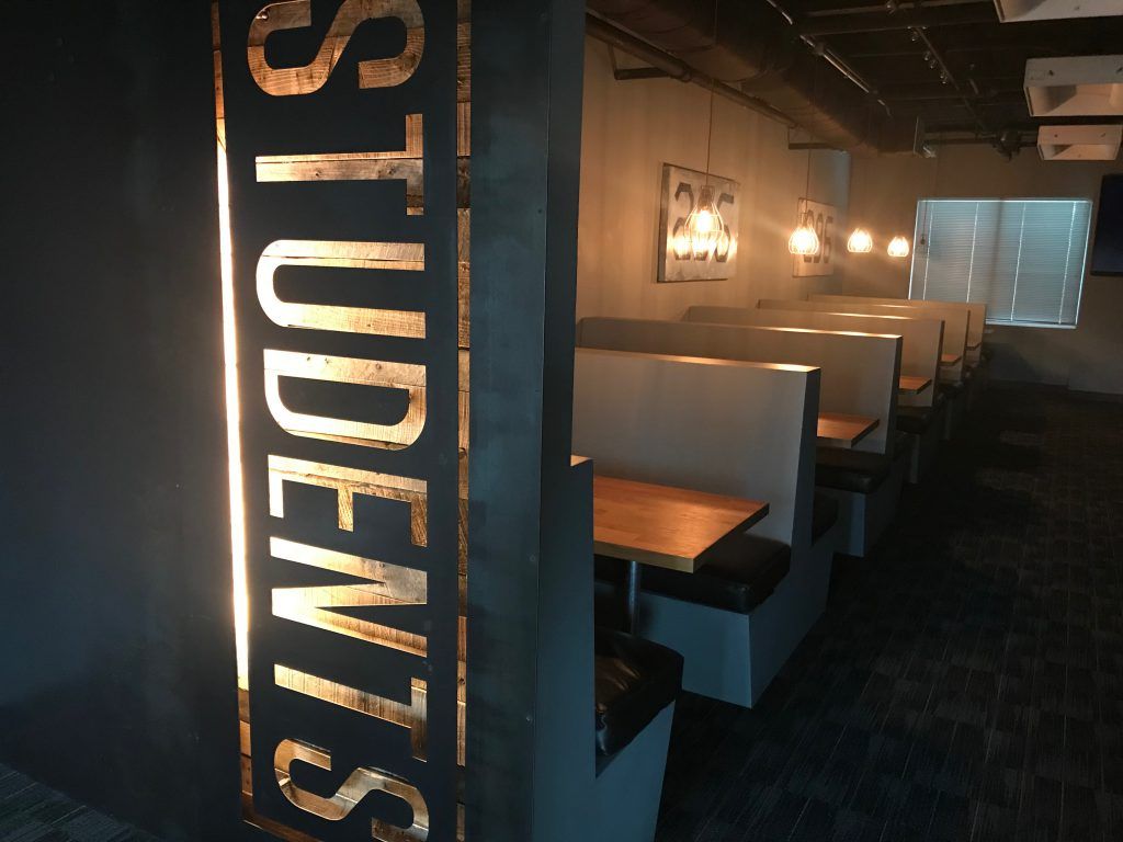 A row of booths with a sign that says students