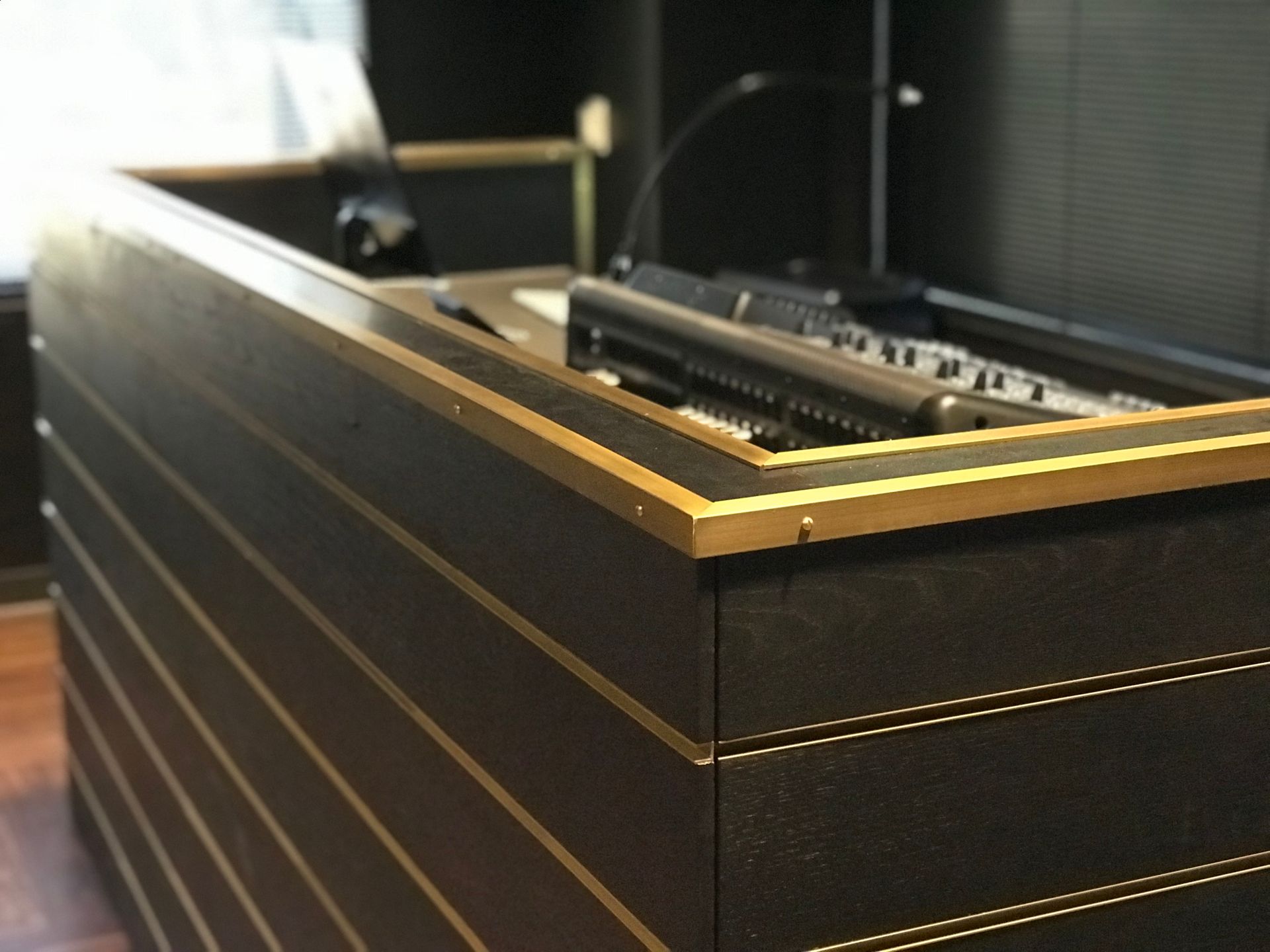 A desk with a keyboard and a microphone on it