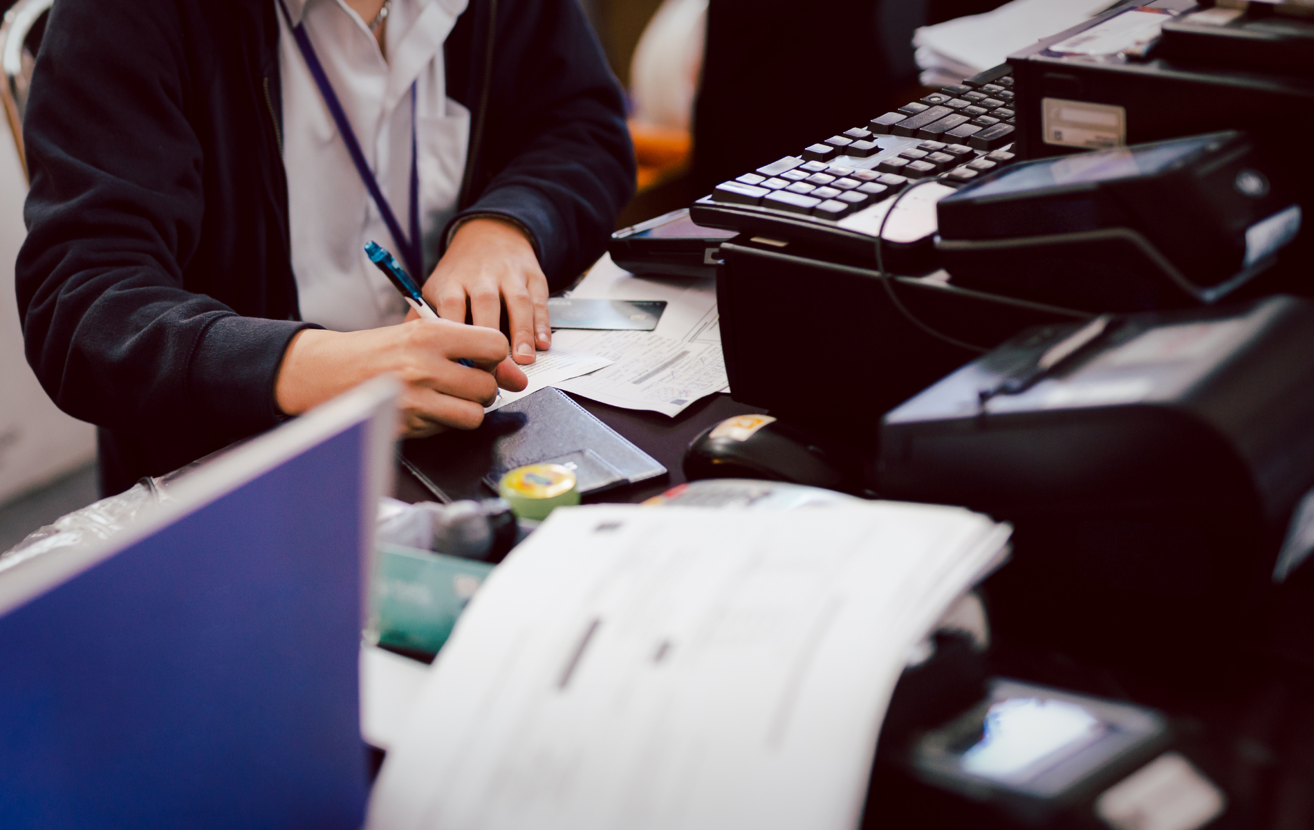 A person is sitting at a desk in front of a computer.
