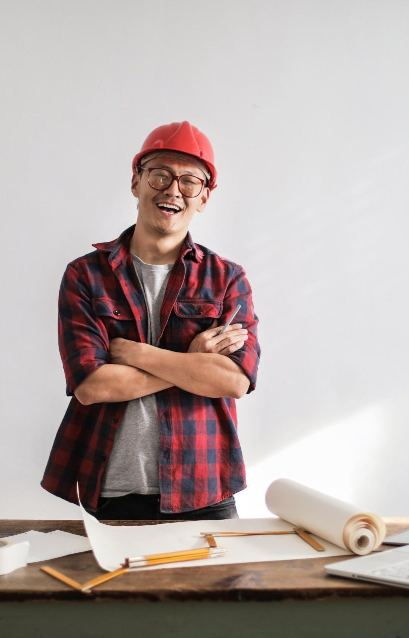 a person wearing a hard hat and glasses