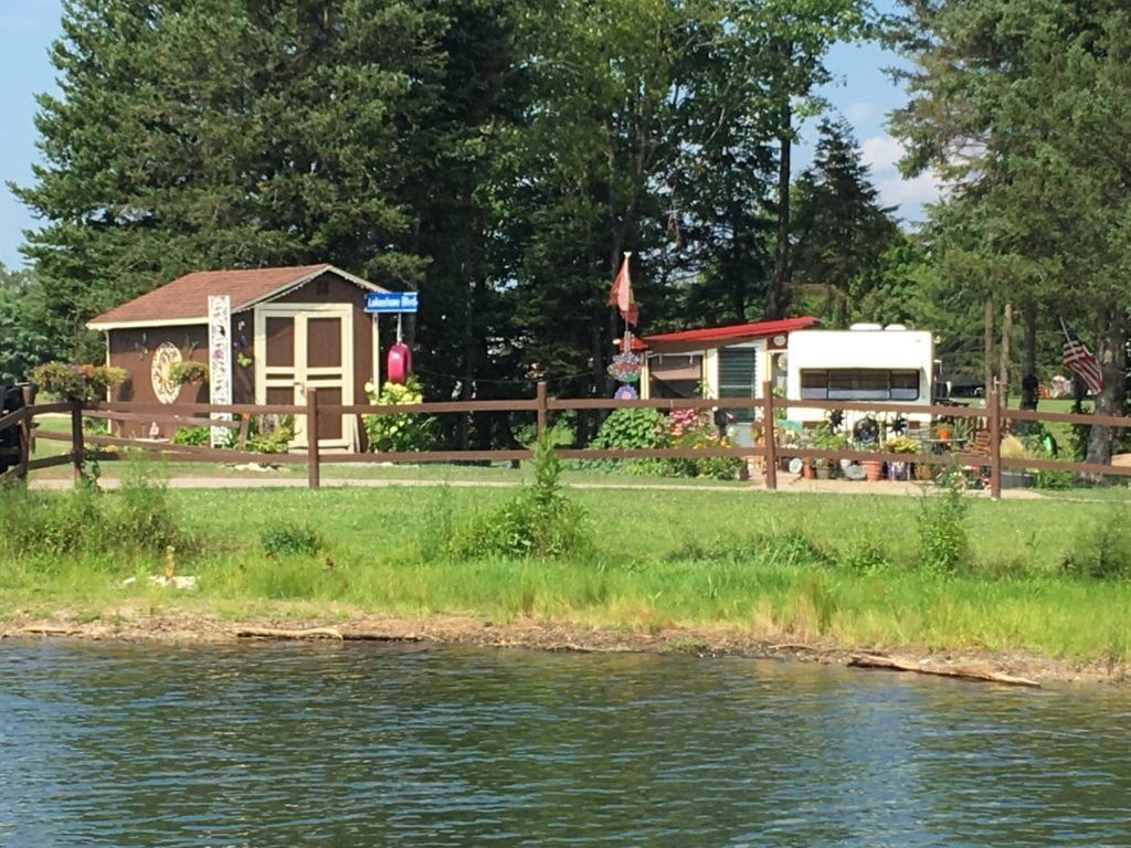 A fenced in area next to a body of water